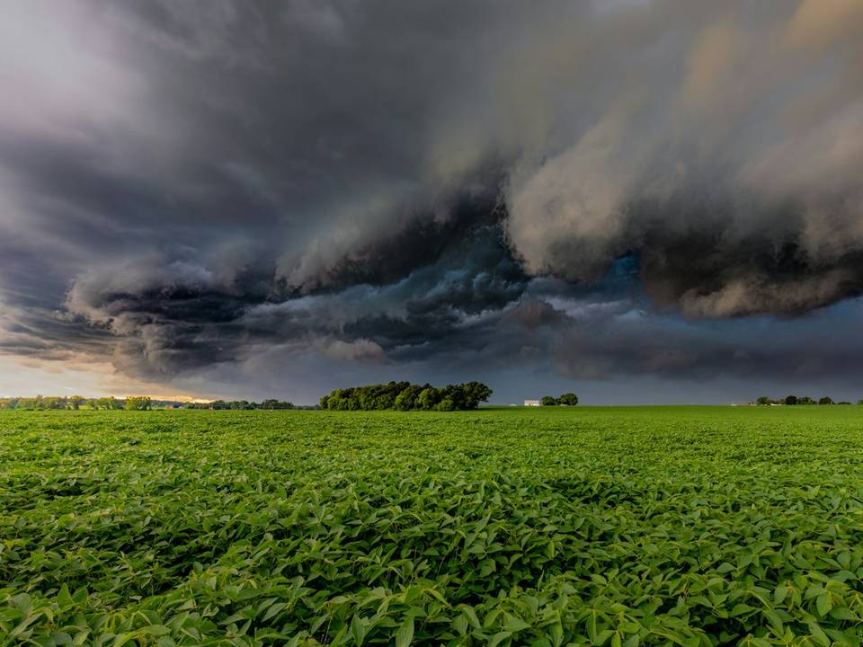 Storm clouds building over open North Texas land